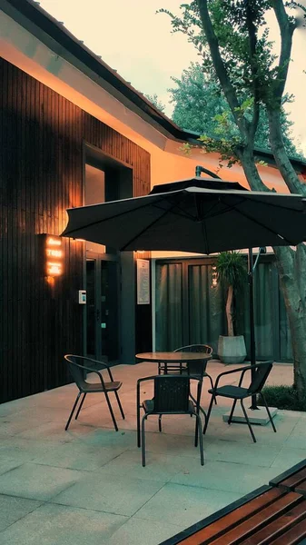 modern outdoor patio with chairs and tables