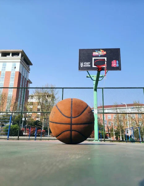 basketball court with ball and a basket