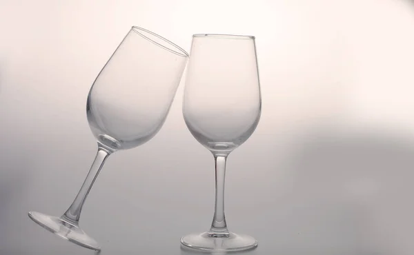two glasses of wine on a white background