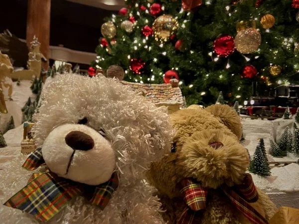 christmas tree with teddy bear and gifts