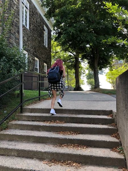 young woman walking on the stairs