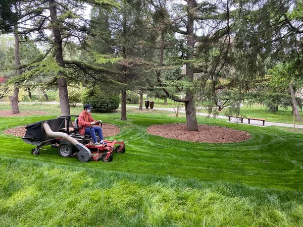 man mowing a lawn mower in the garden