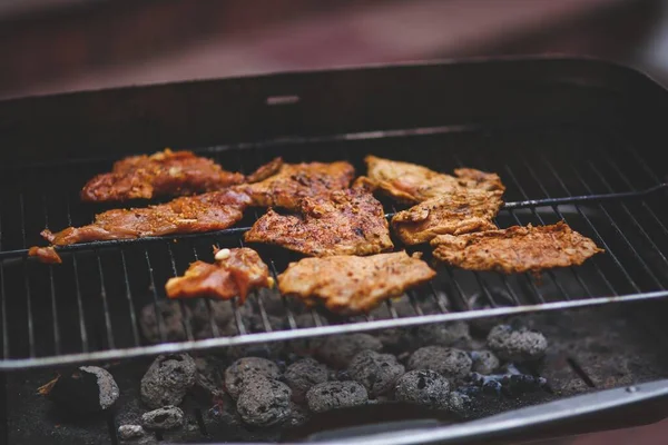 close up of delicious grilled meat on grill