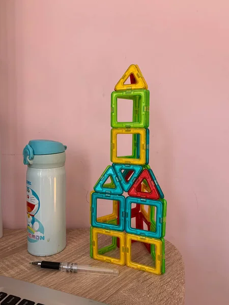 toy house with a wooden background
