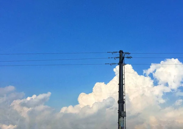 high voltage power lines and blue sky