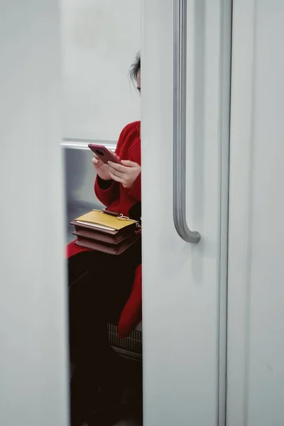 woman reading book in the window