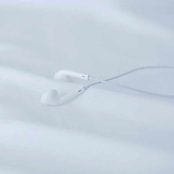 white cotton fabric with a needle