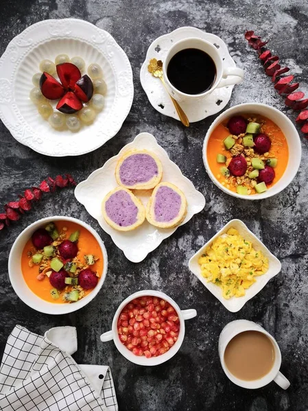 breakfast with coffee and berries on a white plate
