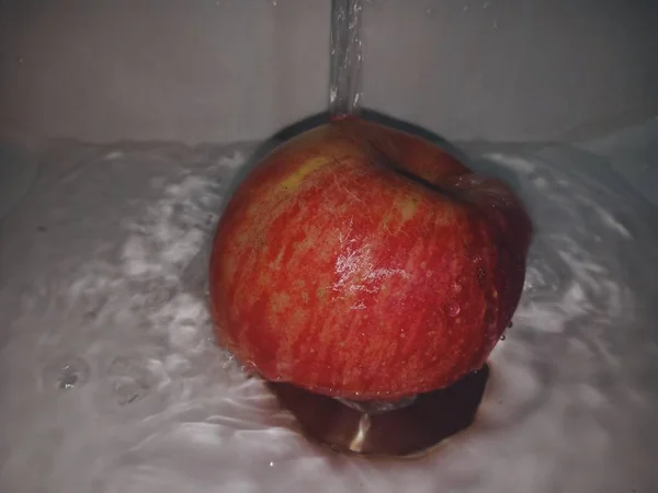 fresh red apple on a white background