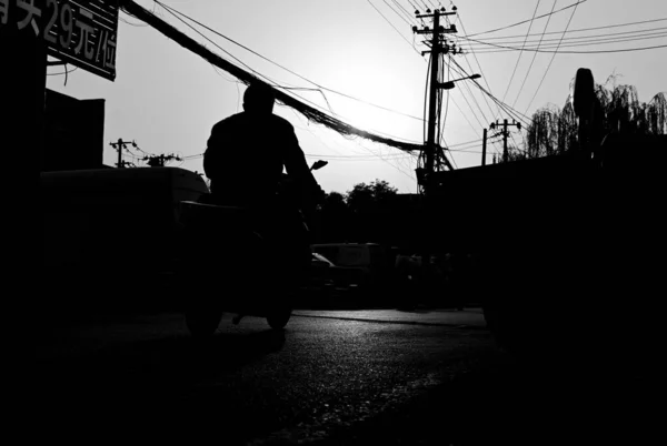 silhouette of a man and woman on the background of the bridge