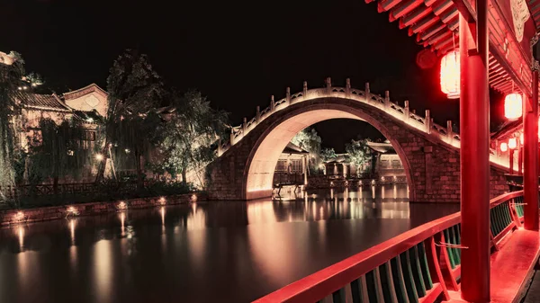 the old bridge in the city of the most famous landmark in the background