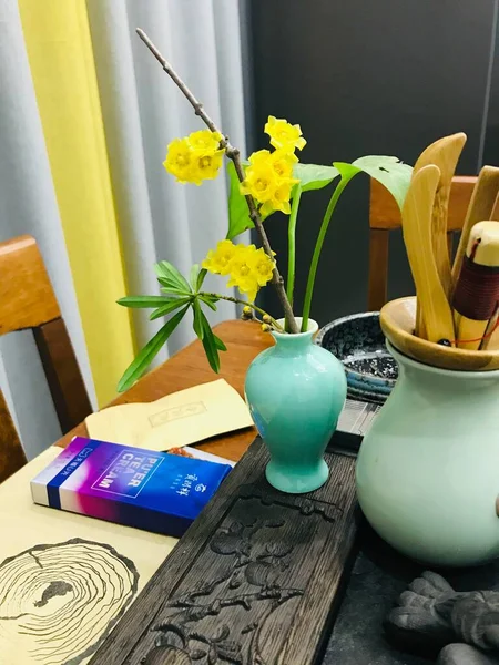 beautiful flowers and a cup of tea on a table