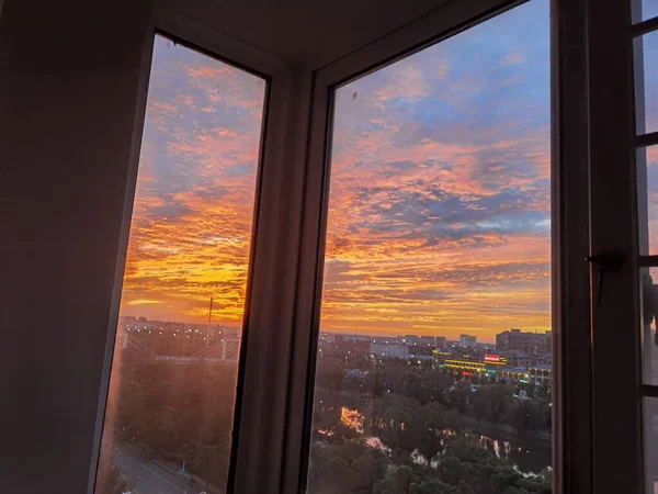 window with sunset sky and clouds