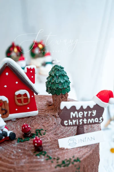 christmas gingerbread house with snow and fir tree on a white background.