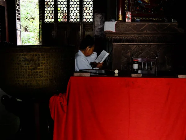 man in a cafe with a book