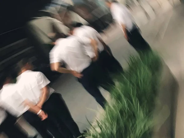 blurred motion blur people walking in the city