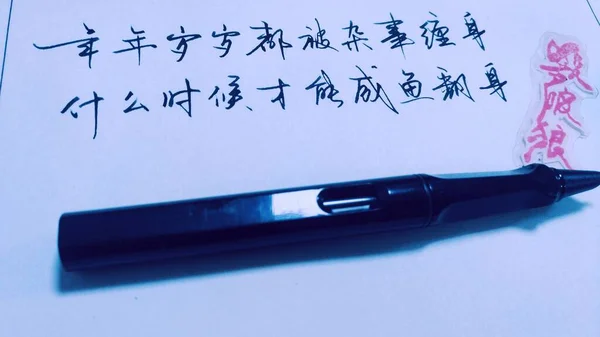 writing note on paper with pen