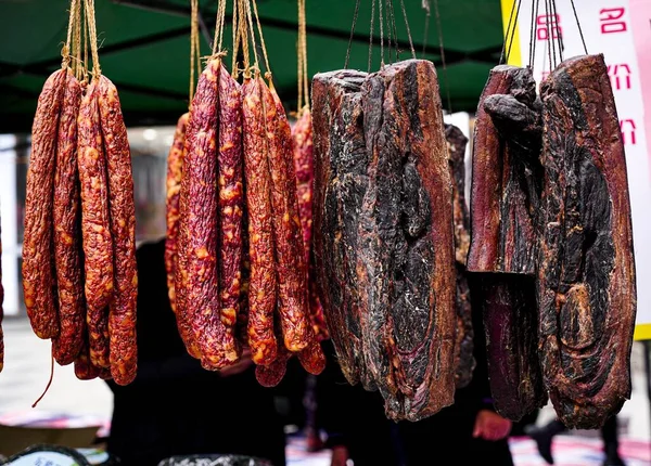 fresh sausage on a market stall