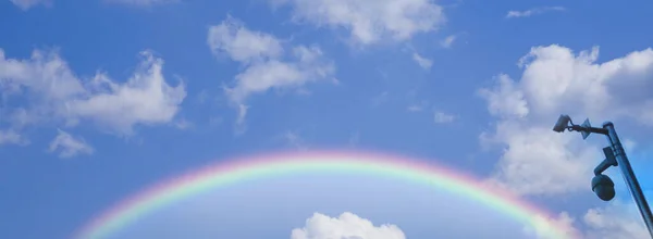 rainbow sky with clouds and blue skies