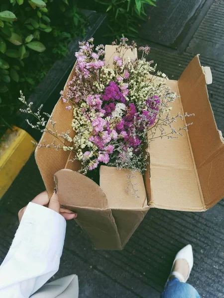 a bouquet of flowers in a box