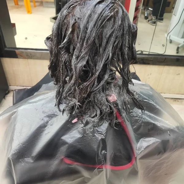 hairdresser cutting hair in a shop