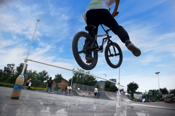 bmx rider riding a bicycle on the street