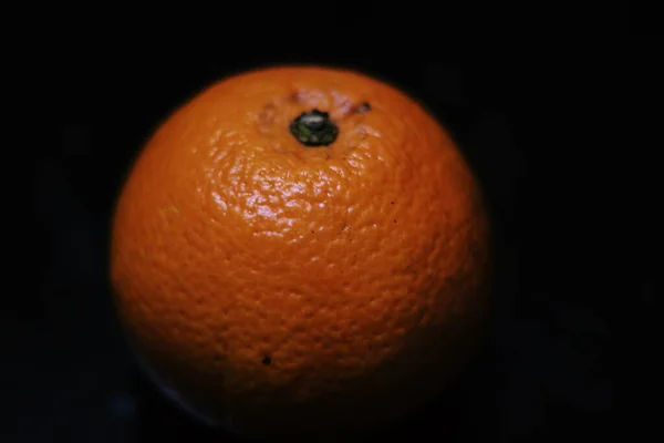 fresh orange on black background