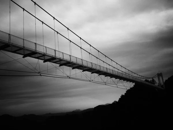 black and white photo of the bridge in the city of the most famous landmark of the new york