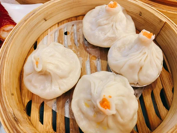 steamed dumpling with dumplings and sauce