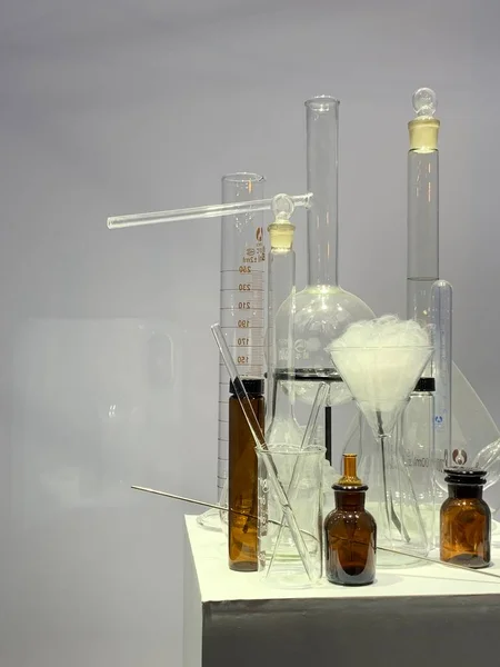 laboratory glassware with liquid and chemical tubes