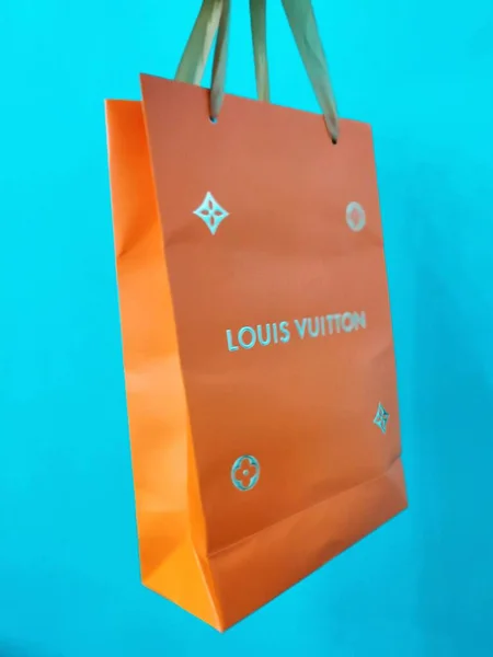 shopping bag with paper bags on blue background