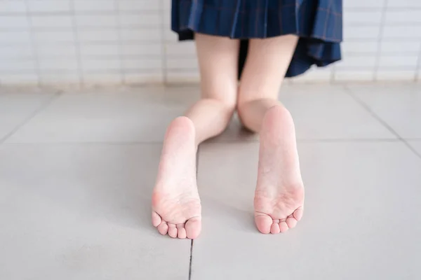 feet of a woman legs on the floor
