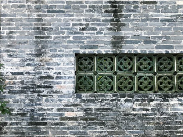 old brick wall with a window