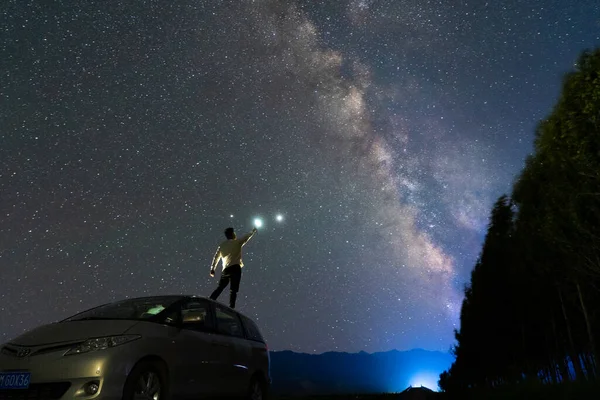 silhouette of a man and woman on the background of the mountains