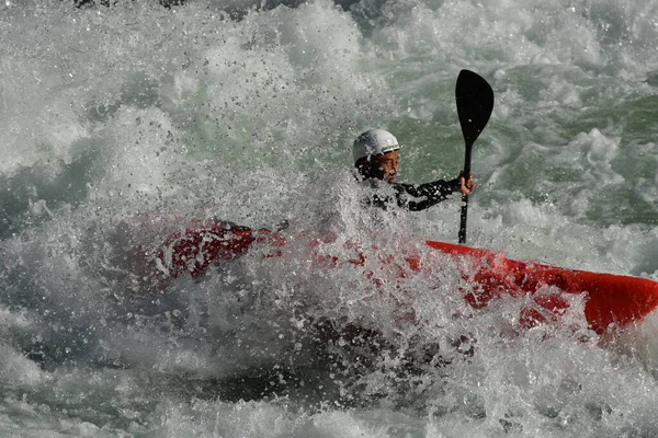 man in action with a ball in the water