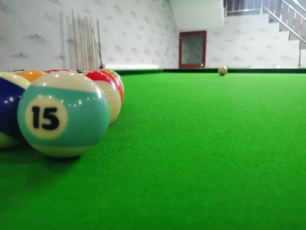 billiard balls on the pool table