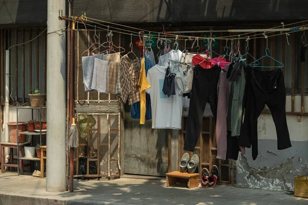 laundry shop, hanging on the street