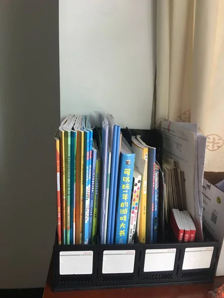 stack of books and documents on the table