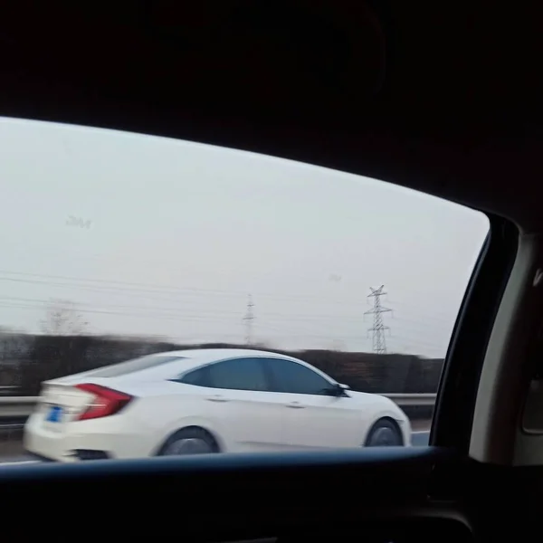 car windshield, driving, motion blur, modern background