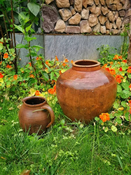 clay pot with a jug of water