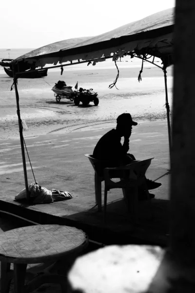 black and white photo of a couple in the sea