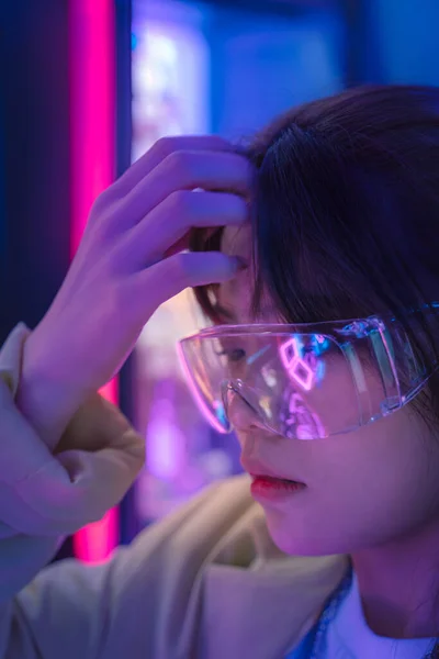 young woman scientist in a lab coat with a glass of water