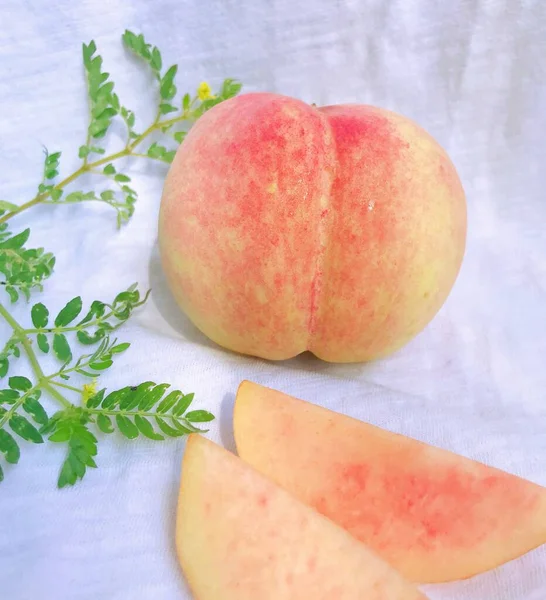 fresh ripe peaches on white background