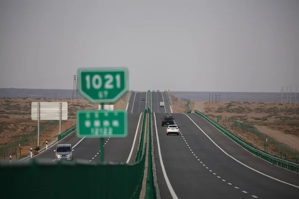 highway with road sign on the background of the sea