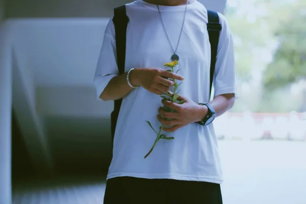 young man with a bouquet of flowers