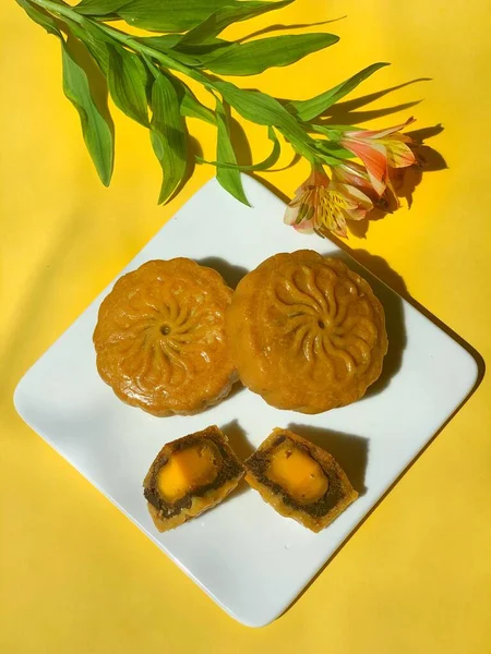 chinese traditional dessert cake with yellow and white chocolate