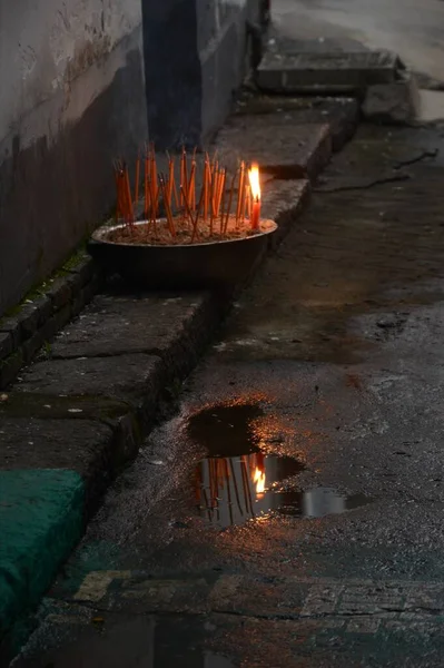 burning candles in the city