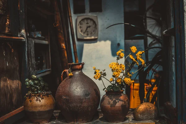 old wooden table with a vase and a jug