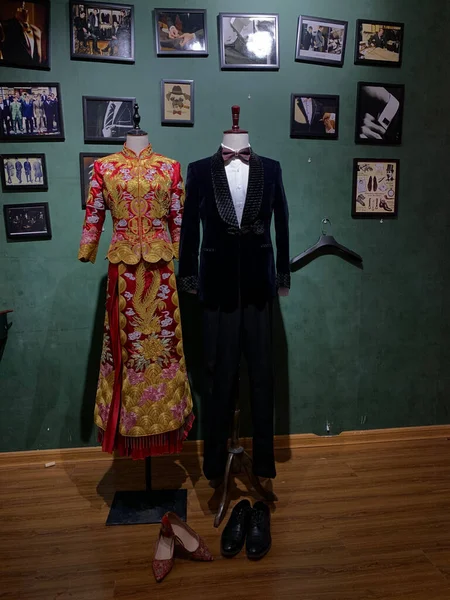 mannequin in a suit and a jacket on a hanger