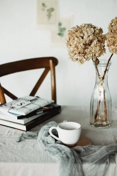 vintage photo of a cup of coffee and a book on a white background